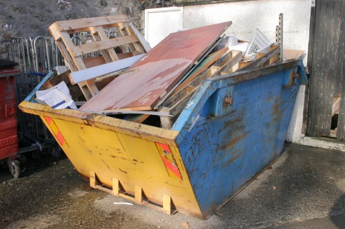 Workers managing builders waste at a Highbury construction site